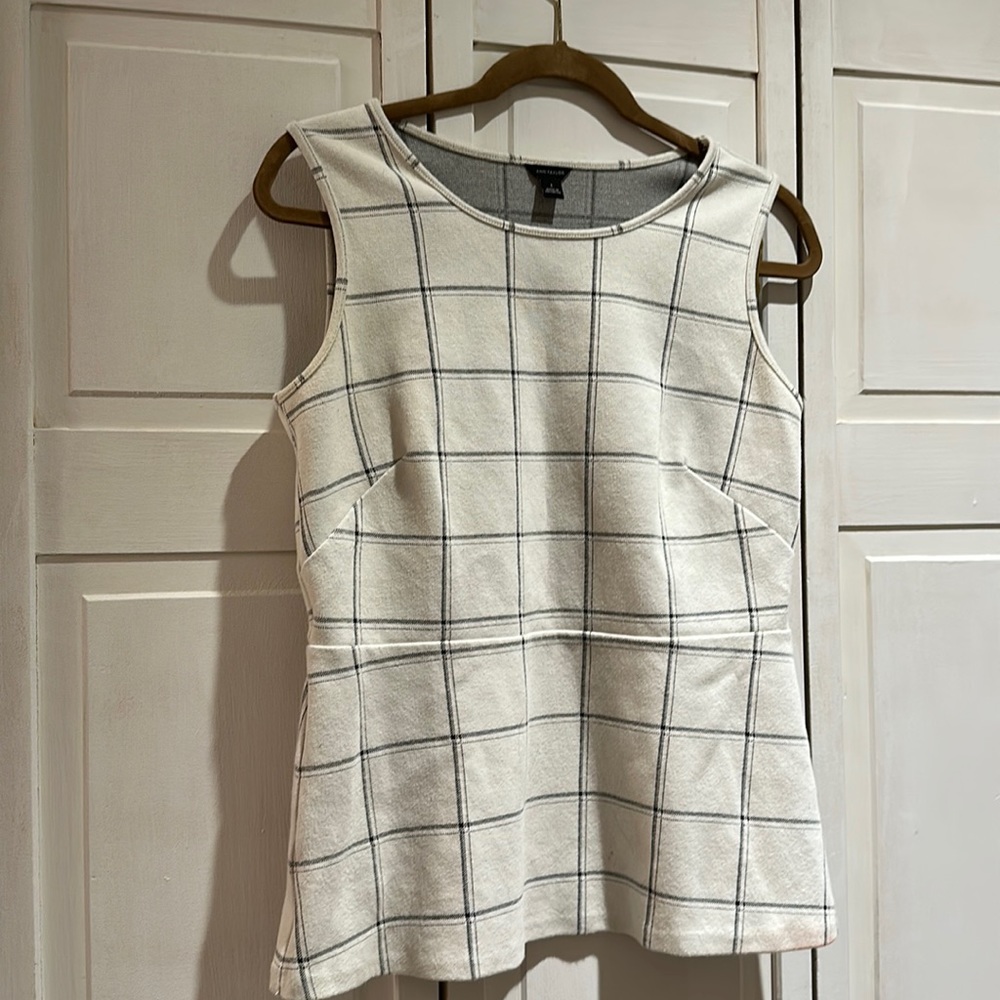 Sleeveless peplum top